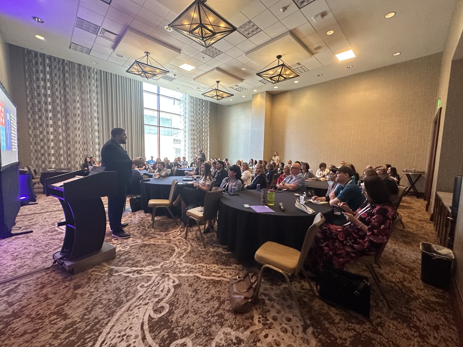 Side angle of Stephen speaking to a large group
